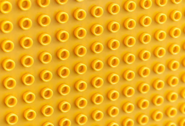 Yellow abstract background with many holes
