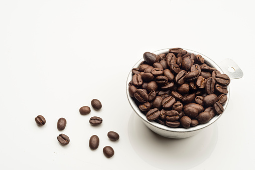 Coffee beans and instant coffee close-up on a white background, isolated. Top view