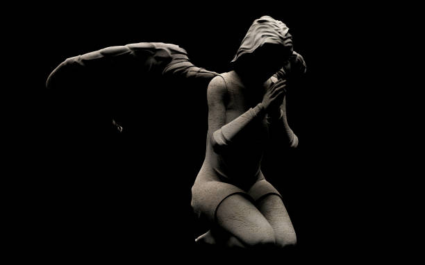 istock 3d render illustration of stone angel statue praying on dark background. 1610579097