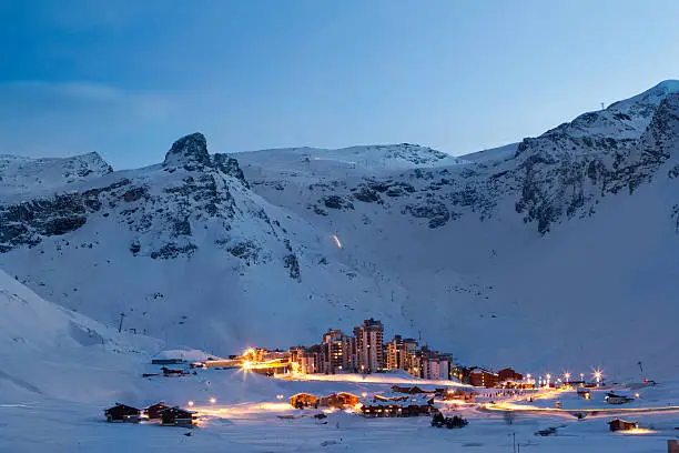 View of Val Claret from Tignes Le Lac at night. Light trails can be seen from traffic passing through Val Claret, and also from machines on the mountain grooming pistes. XXL Image size.
