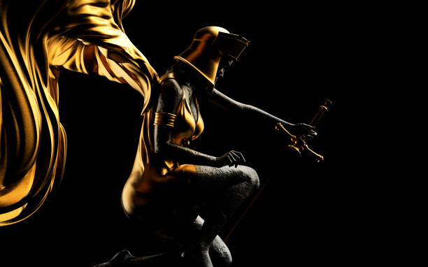 istock 3d render illustration of golden angel statue with sword on black background. 1610580121