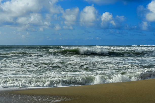 Early morning ocean waves and clouds as a storm passes through the area.\n\nTaken in Davenport, California, USA