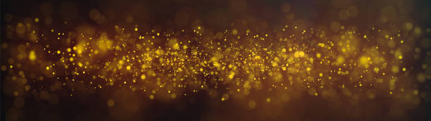istock Orange sparkles, dust particles, ultra wide background 1610609860