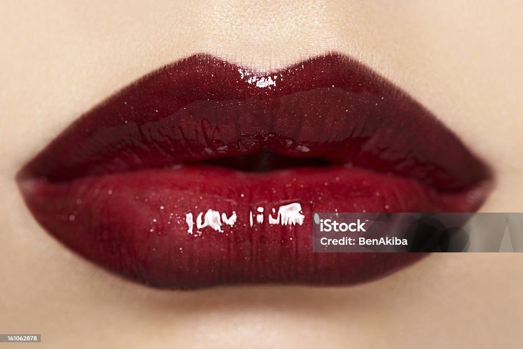 Beautiful Lips with Glossy Lipstick Beautiful Lips with Glossy Lipstick , focus on upper lip, shallow dept of field for more of a dreamy look Close-up Stock Photo