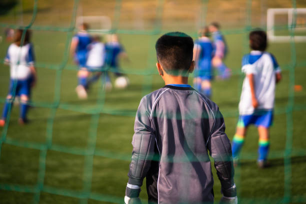 istock Soccer goalie defends goal. 1610631887