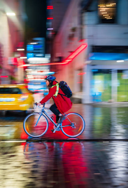Cyclist riding bicycle outdoor in the city with blur background.