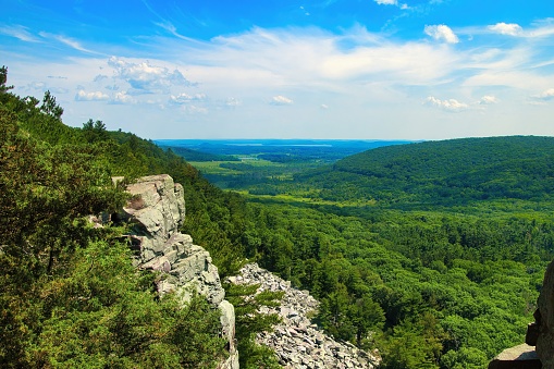 A Summer's day view of a valley forest from atop a rocky bluff at Devil's Lake State Park near Baraboo, WI.