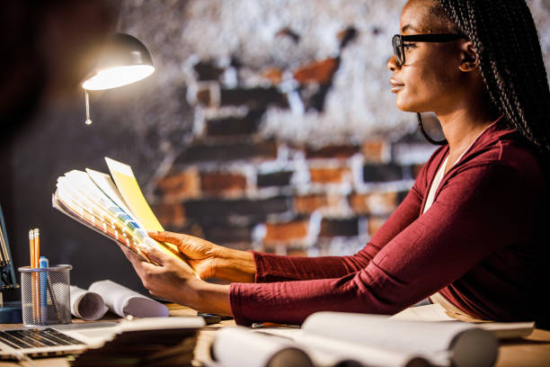 istock Creative female architect reviewing color swatches for a project she is working on 1610666904