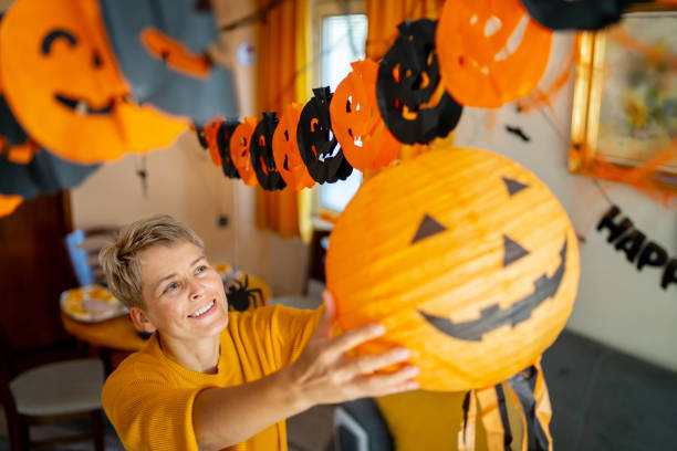 istock A woman is enjoying decorating her home for halloween 1610666992