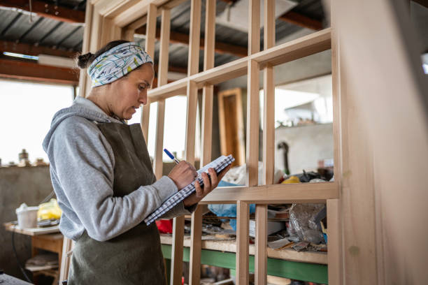 istock Small business. Female carpenter working in her workshop. 1610674801
