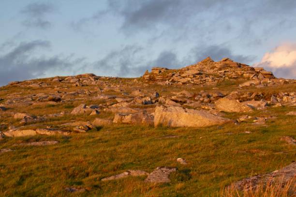 istock Rough Tor rock formations at dusk, Bodmin Moor. Cornwall, UK 1610693444