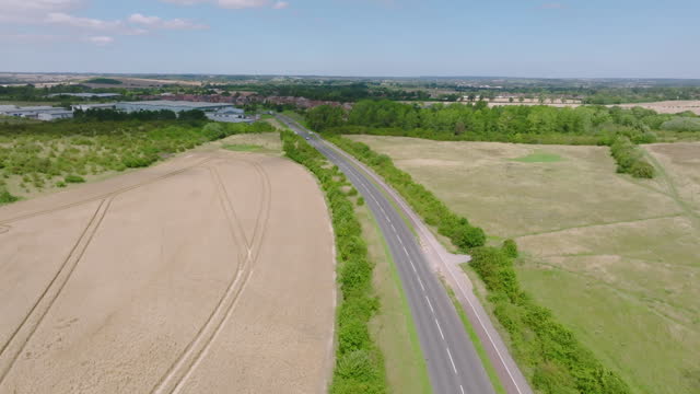 Drone view of country road at suburb in Midlands, England