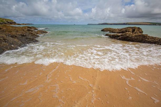 istock Sand, sea and waves at Harlyn Bay, Cornwall, UK 1610698958