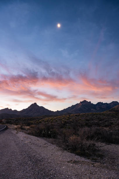 istock Moon Sits High In The Sky Over Chisos Mountains At Sunrise 1610730700