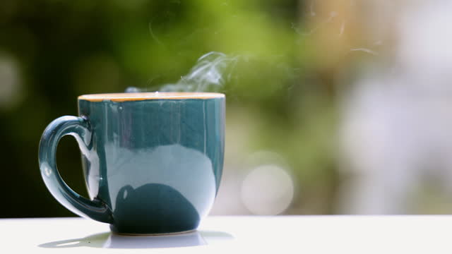 Close-up of hot coffee in beautiful morning with steaming