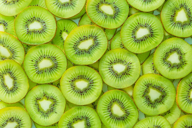 istock macro kiwi,Fresh Kiwi fruit sliced use for background,slice of kiwi fruit on a full frame. horizontal format 1610792491