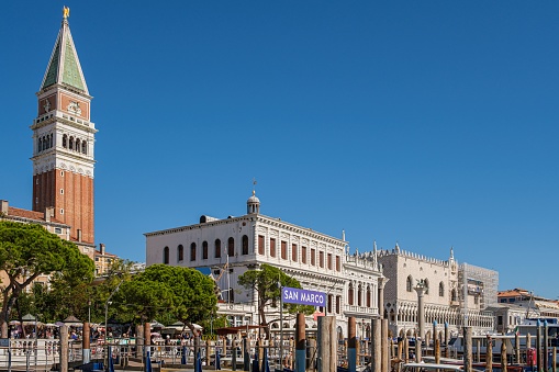 Venice, Italy – September 19, 2022: A majestic white building with an impressive bell tower situated atop, stretching to the sky