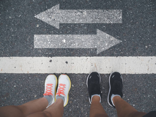 istock paved road with arrows pointing in two directions 1610963868
