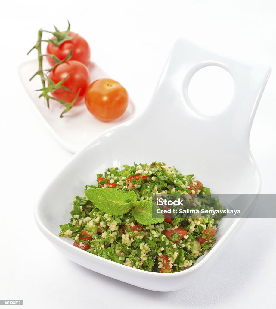 tabbouleh bowl of fresh tabbouleh salad Mint Leaf - Culinary Stock Photo