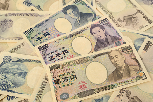 Closeup of 1000, 5000 and 10000 Japanese yen banknotes.