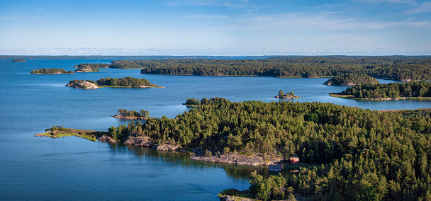 Finland Turku Archipelago at Tärpänänaukko Coast Islands and Islets in Summer. Aerial Drone Panorama of the natural Turku Archipelago Coast, Tärpänänaukko Archipelago in Summer. Warm late afternoon light close to sunset. Turku Southwestern Finland Nature in Summertime. Naantali Turku Archipelago, Rymättylä, Finland, Nordic Countries, Scandinavia, Northern Europe.