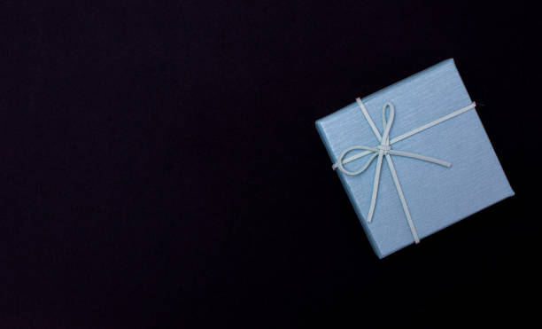 istock Christmas gift boxes isolated on black background, except copy space. 1611152776