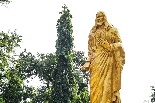 The golden statue of Christ the king as a symbol of the Lord Jesus Christ the king of Catholics in Maumere City, Flores, East Nusa Tenggara, Indonesia