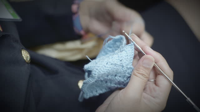 Woman crochets for her child
