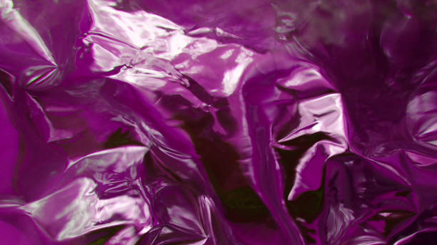 istock Reflective metallic pink and white fluid background 1611281190