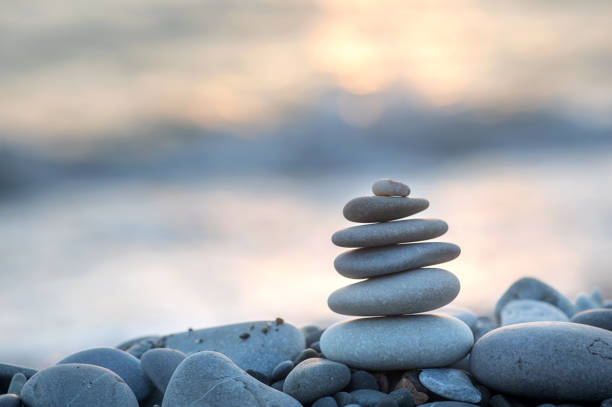istock Stones balance on beach. Zen meditation and relaxation 1611284337