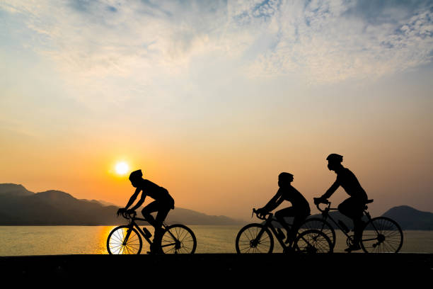 istock Silhouette of cyclist in motion on the background 1611291734
