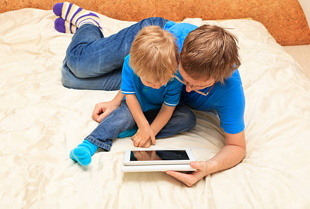 istock family with touch pad at home 161129733