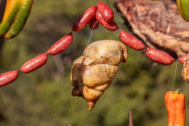 istock hanging chicken meat roasting outdoors 1611308301