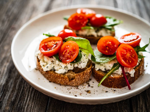 istock Breakfast - cottage cheese, bread and vegetables on wooden table 1611321118