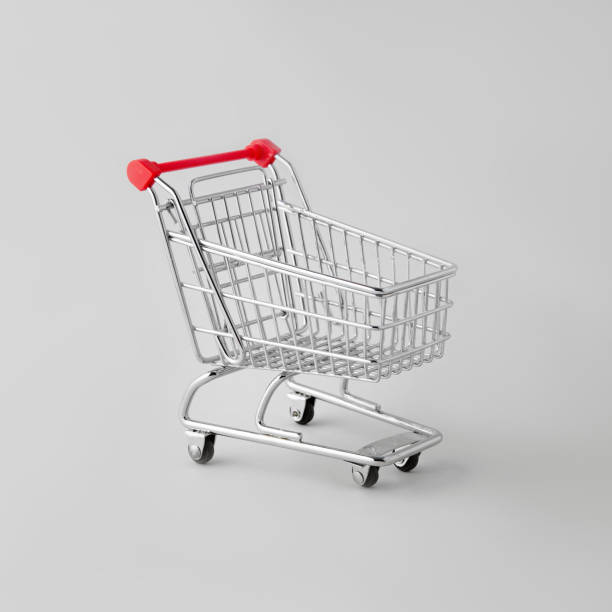 istock Empty shopping cart from a supermarket on a gray isolated background. 1611352067