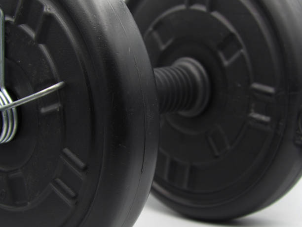 istock Hand dumbbells in black with white background 1611355870