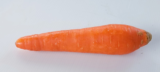 One large carrot, isolated on a white background. (Clipping path included.)