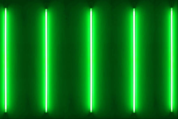 istock Five green neon bulbs on white wall. light green neon lamp style glow. 1611367061