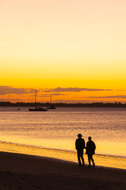 Couple walking Along the Esplanade at Sunset