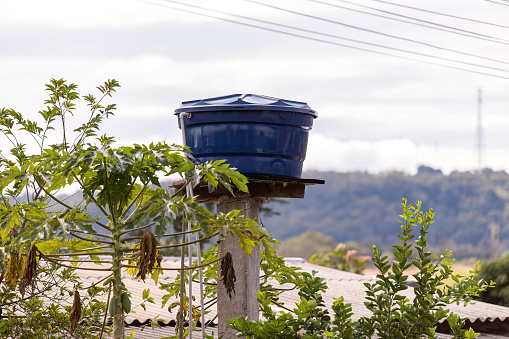 Blue plastic water tank used in residential constructions in Brazil