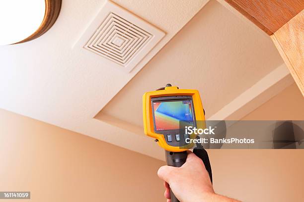 Infrared Thermal Imaging Camera Pointing To Attic Access Stock Photo - Download Image Now