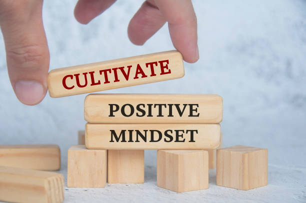 istock Cultivate positive mindset text on wooden blocks. Continuous improvement concept 1611429802