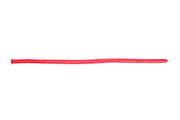 istock Unblown red balloon isolated on white 1611454805