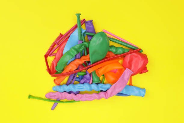Colorful inflatable balloons scattered on a table.
