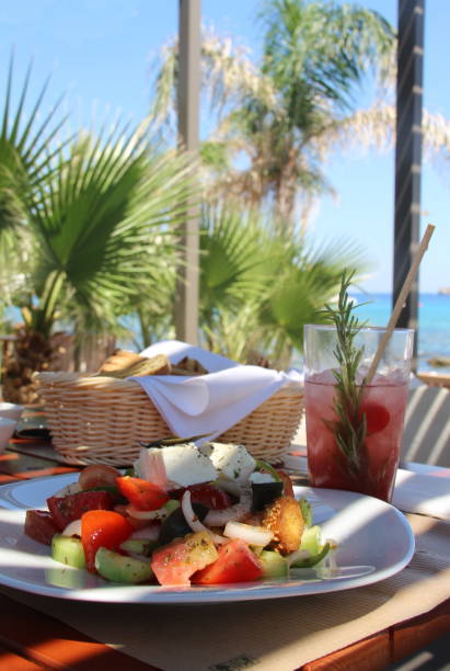 istock Greek salad on the seacoast 1611465461