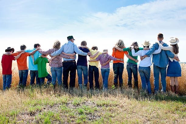 Christian Religious Family Group Prays to God Thankful Crop Farm A joyful family offers thanks to God for the success of their wheat crop on their farm. Represents faith, "down home" family values and an ethic of hardwork and love. rural main street stock pictures, royalty-free photos & images