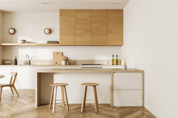 istock Modern home kitchen interior with cooking and dining space with modern furniture 1611518135