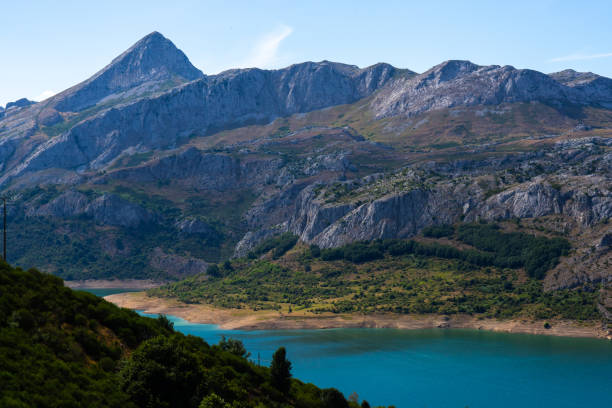 istock Tall Mountains and Blue Lake: Stunning Nature Scene 1611520805