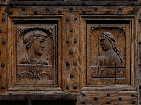 Saint Come d'Olt, Saint Come and Saint Damien church: carved oak doors, 1532, Aveyron