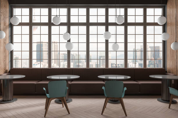 istock Stylish cafe interior with chairs and sofa, eating space with panoramic window 1611531156